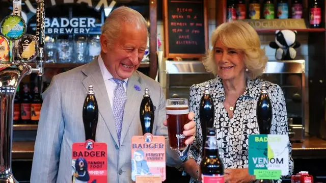 'Good day to drown a few sorrows', says King as he pours pint